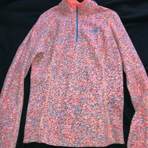 blue, orange, and pink north face quarter zip